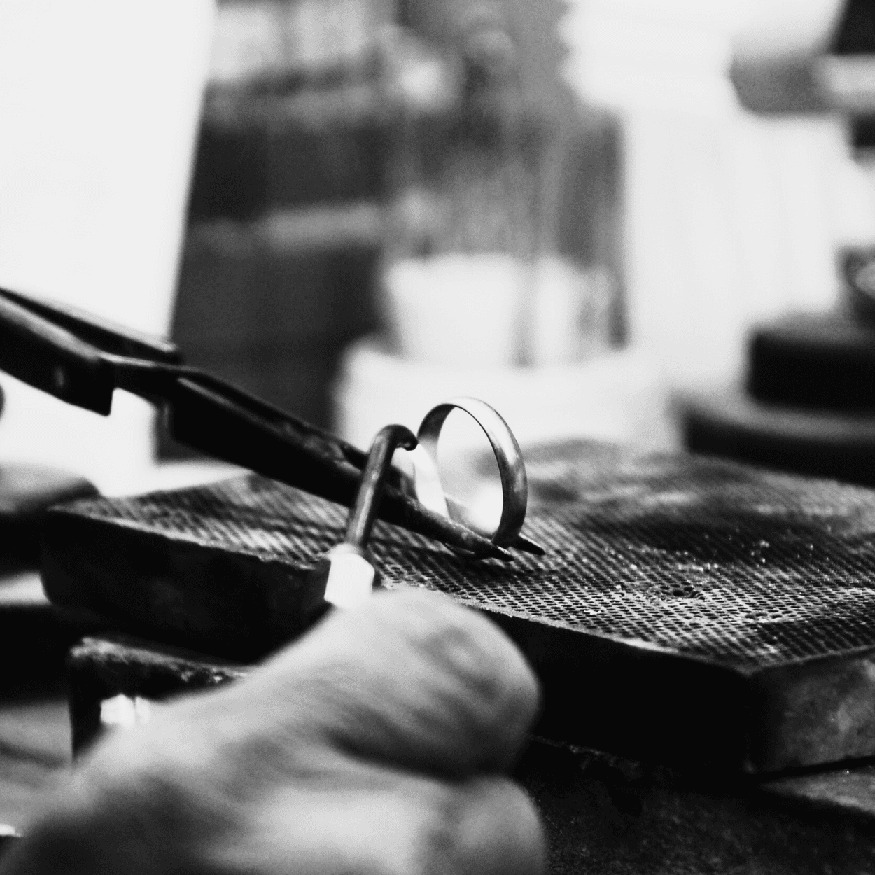 Jewelry craftsmanship - ring being worked on at the jeweler's bench