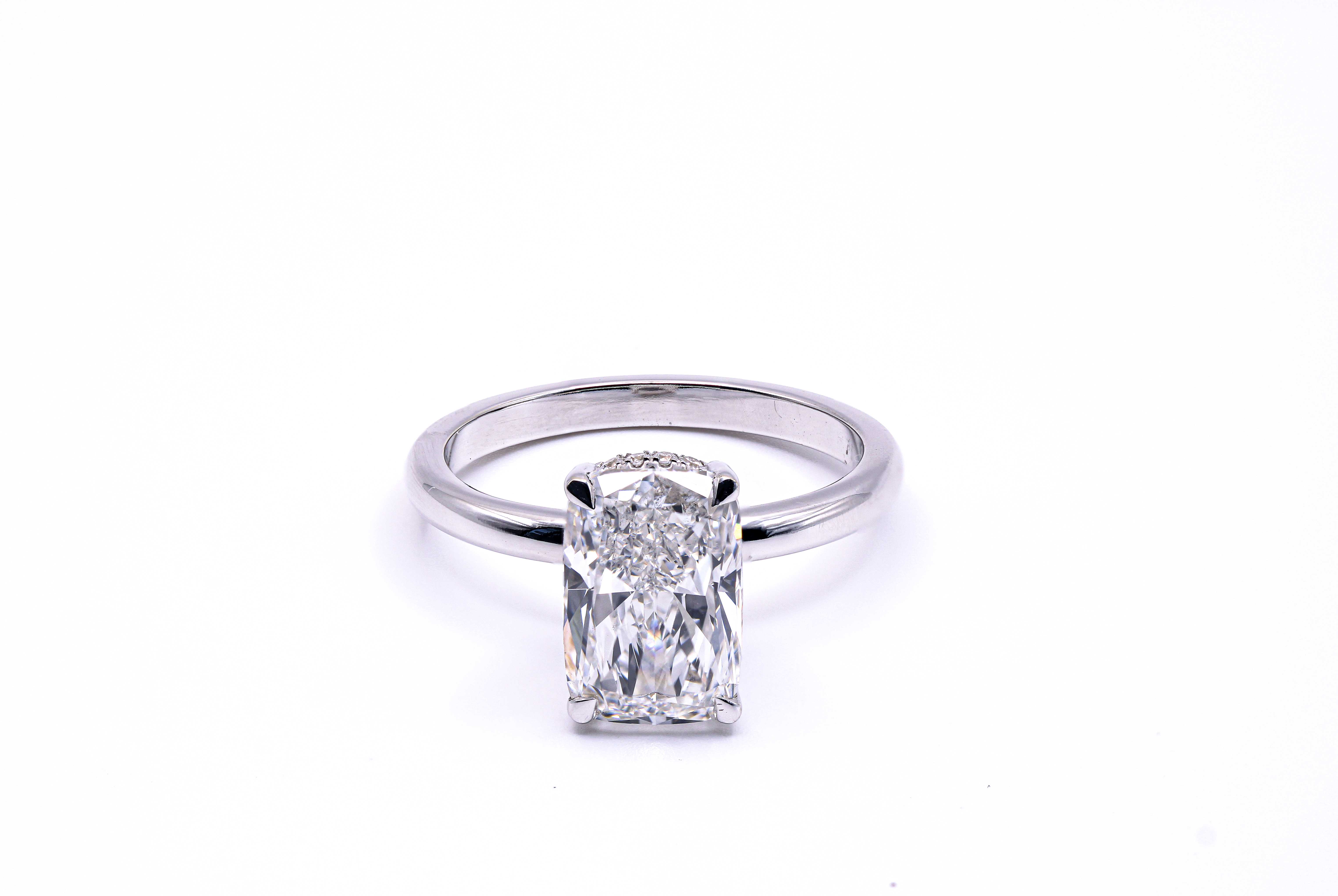 Radiant hidden halo engagement ring